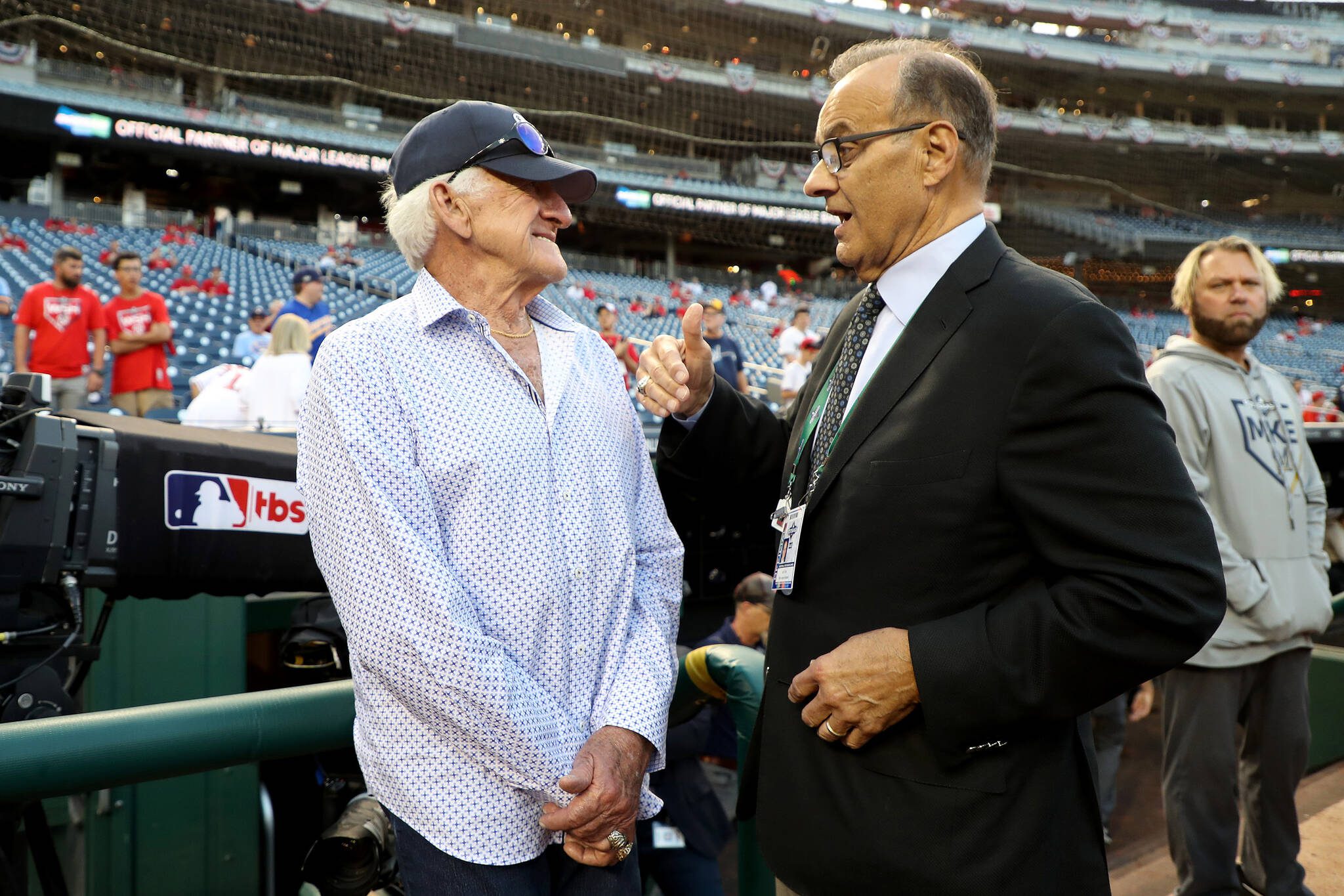 Former player Bob Uecker, left, talks with MLB chief baseball officer Joe Torre prior to the National League Wild Card game between the Milwaukee Brewers and the Washington Nationals at Nationals Park in Washington, D.C., on October 1, 2019. (Rob Carr / Getty Images / Tribune News Services)