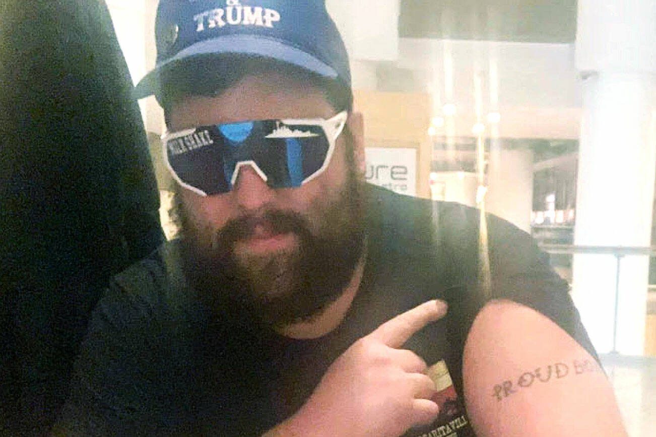 Daniel Scott, displaying a "Proud Boys" tattoo, in a photo from federal charging papers. (FBI) 20210520