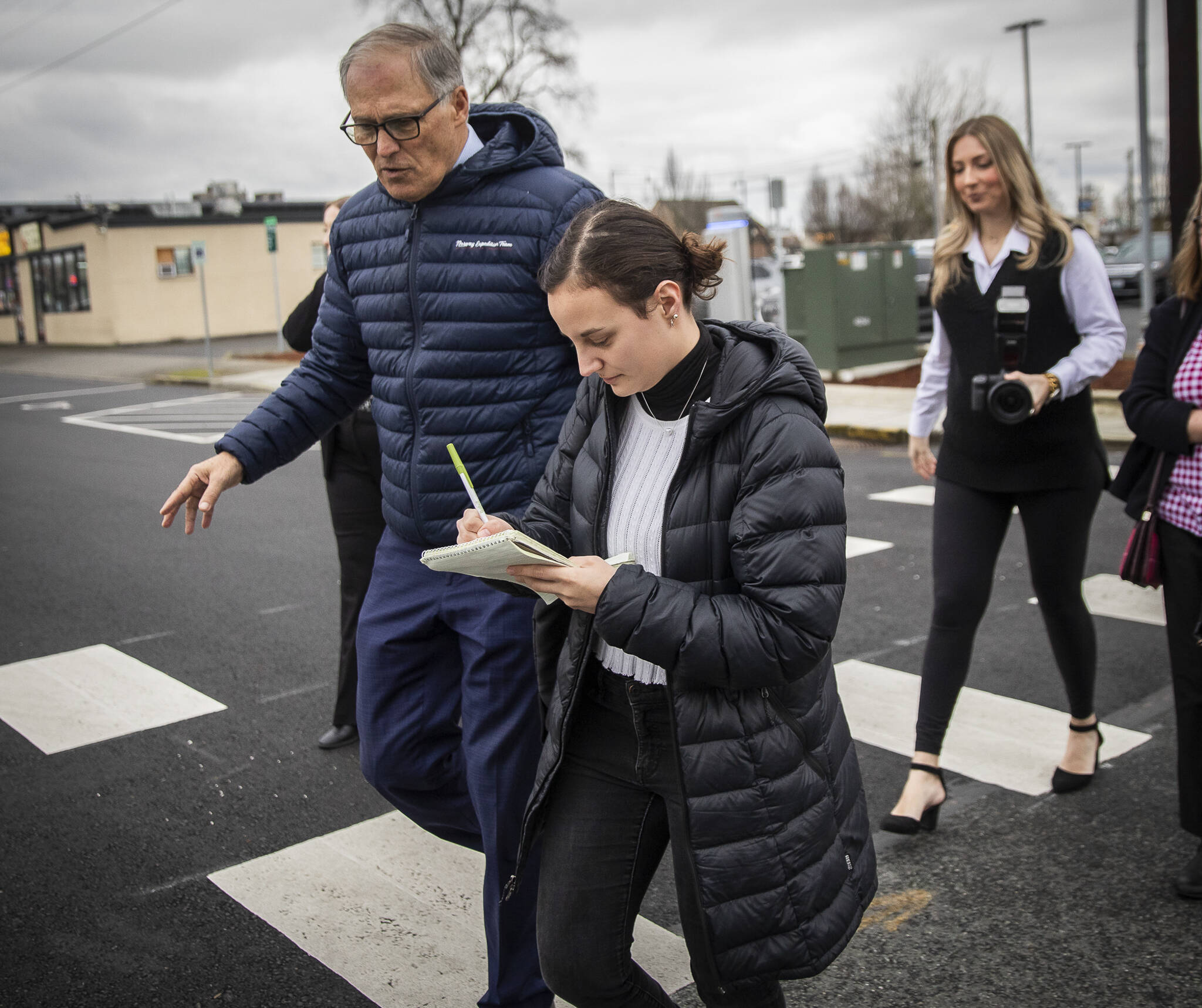 Olivia Vanni / The Herald
Former Everett Herald reporter Ta’Leah Van Sistine walks with former Gov. Jay Inslee while taking notes on Feb. 6, 2024, in Marysville.
Everett Herald reporter Ta’Leah Van Sistine walks with Governor Jay Inslee and takes notes on Tuesday, Feb. 6, 2024 in Marysville, Washington. (Olivia Vanni / The Herald)