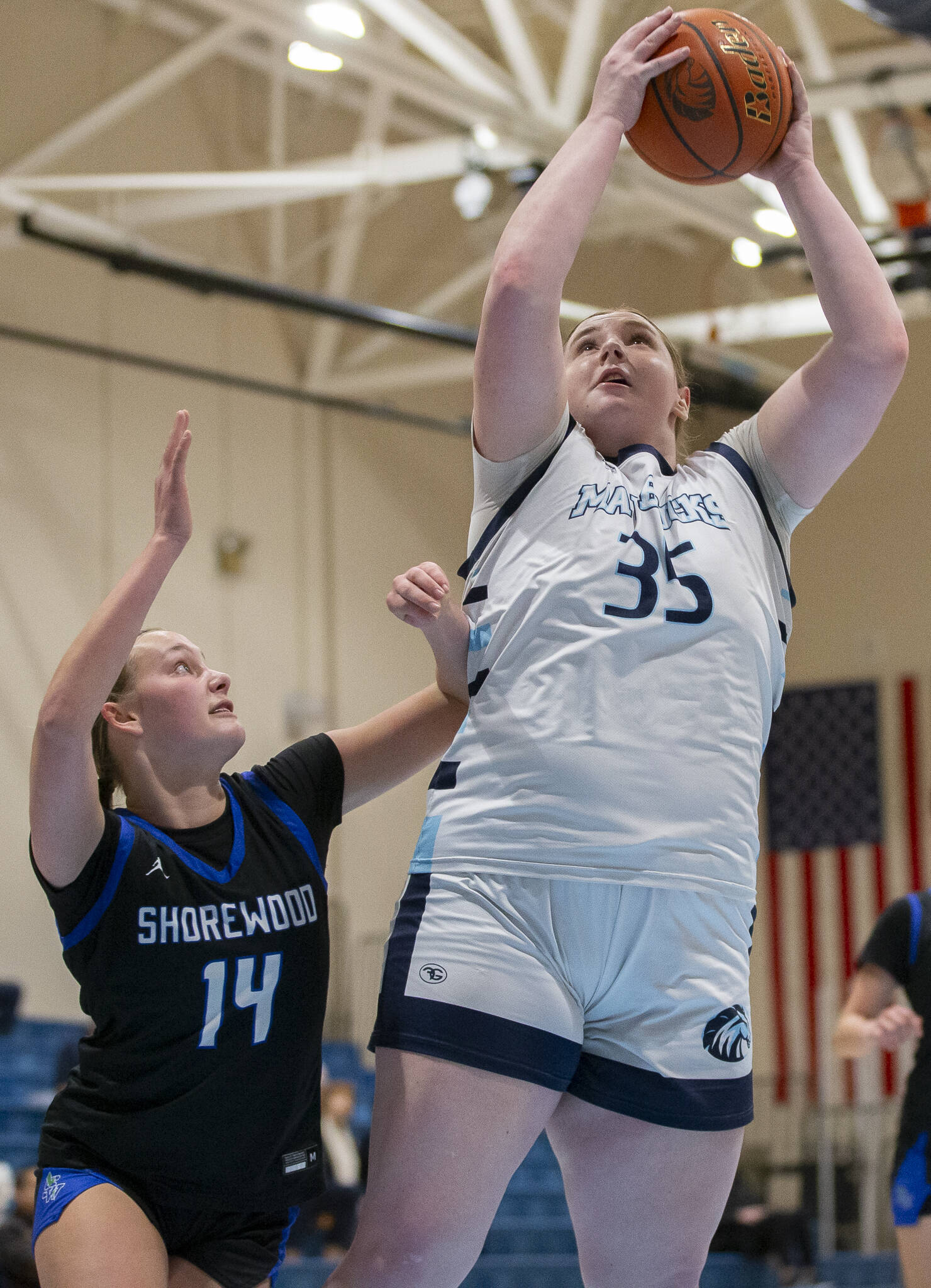Meadowdale’s Audrey Lucas makes a layup during the game against Shorewood on Wednesday, Jan. 22, 2025 in Lynnwood, Washington. (Olivia Vanni / The Herald)