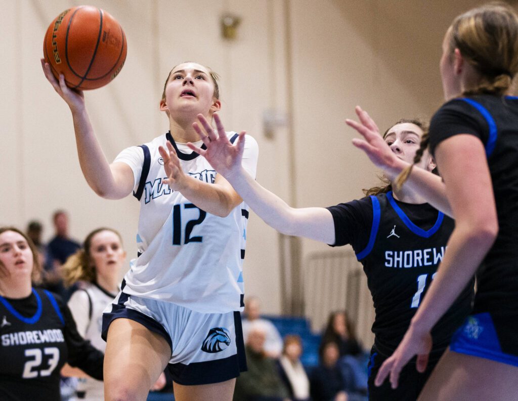 Meadowdale’s Lexi Zardis makes a layup during the game against Shorewood on Wednesday, Jan. 22, 2025 in Lynnwood, Washington. (Olivia Vanni / The Herald)
