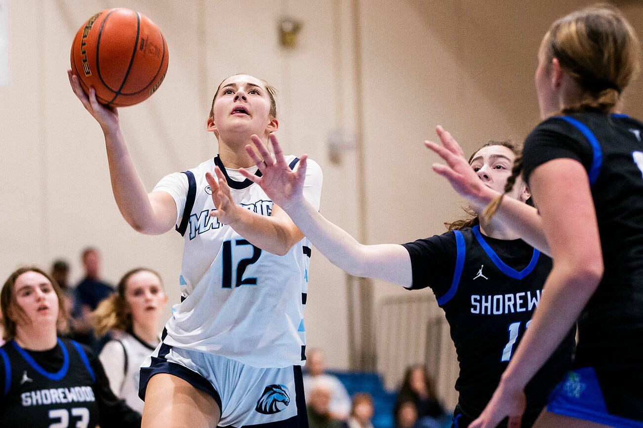 Meadowdale’s Lexi Zardis makes a layup during the game against Shorewood on Wednesday, Jan. 22, 2025 in Lynnwood, Washington. (Olivia Vanni / The Herald)