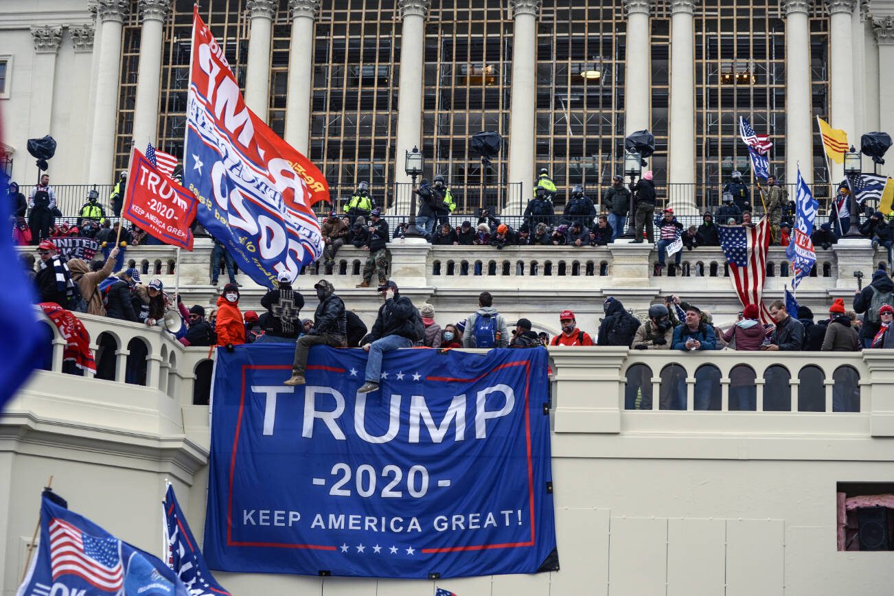 FILE — Supporters of then-President Donald Trump storm the U.S. Capitol in Washington, Jan. 6, 2021. There were no FBI undercover agents at the Capitol on Jan. 6, 2021, according to a Justice Department report. (Kenny Holston/The New York Times)