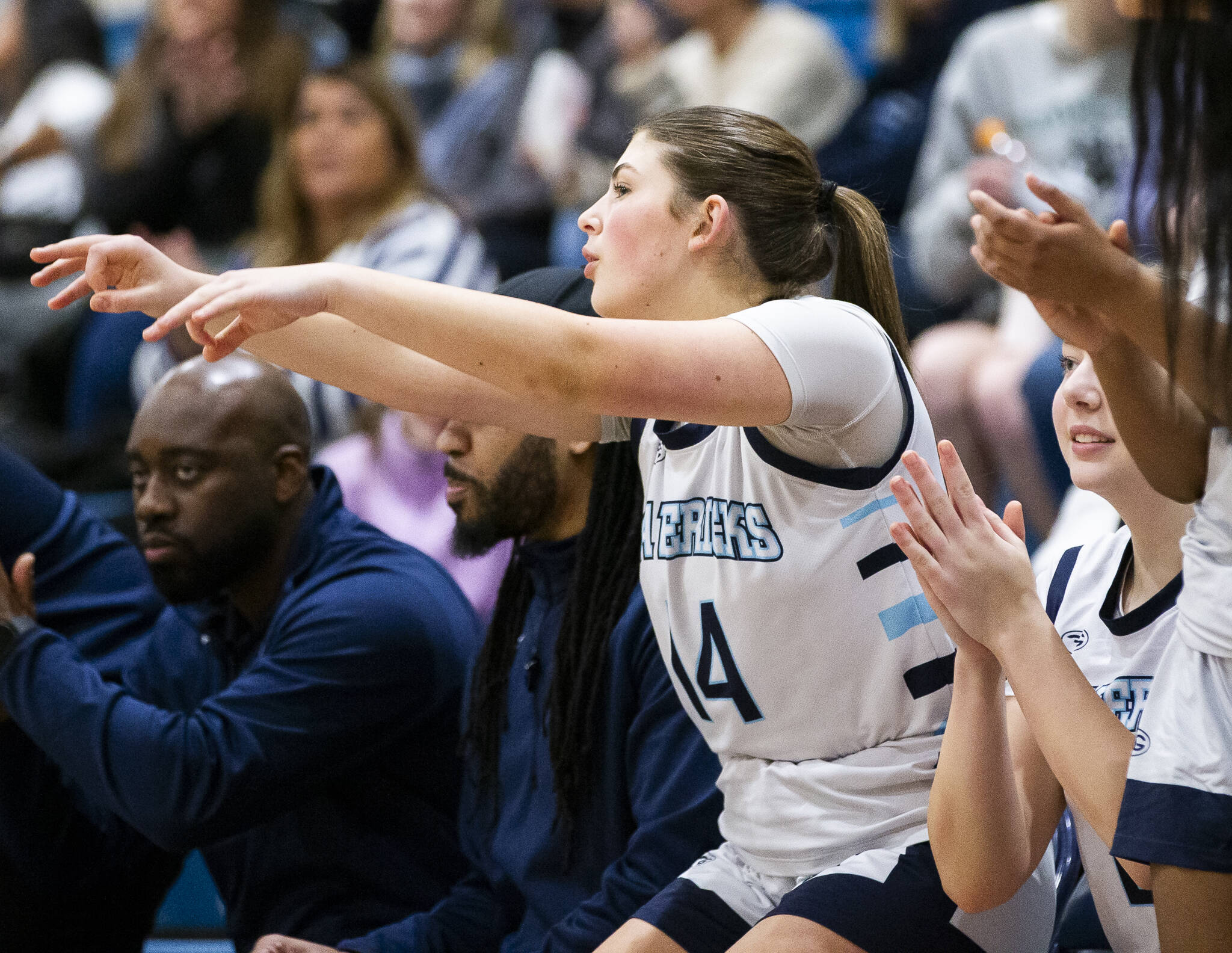 Meadowdale’s Kaya Powell puts three finger in the air in celebration of a teammates three point shot during the game against Shorewood on Wednesday, Jan. 22, 2025 in Lynnwood, Washington. (Olivia Vanni / The Herald)