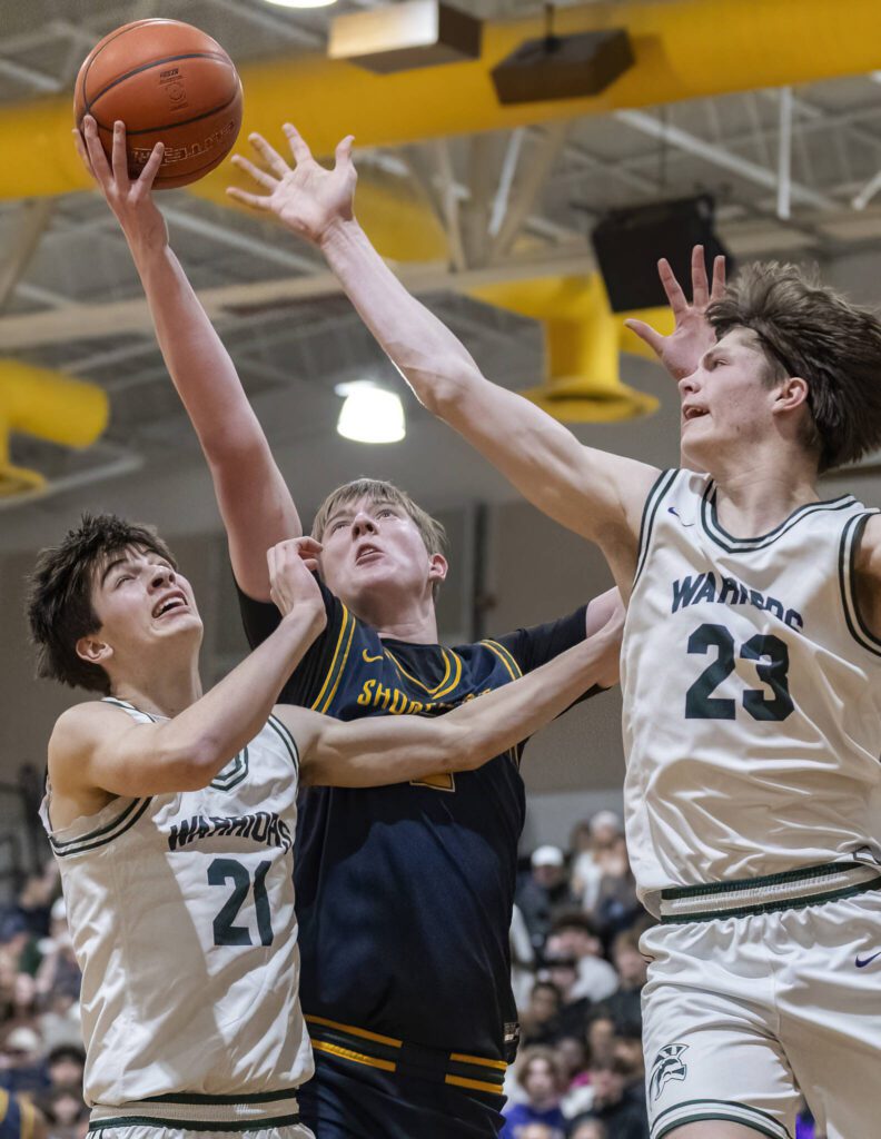 Shorecrest’s Jack Thompson makes a layup off a rebound during the game against Edmonds-Woodway on Tuesday, Jan. 28, 2025 in Edmonds, Washington. (Olivia Vanni / The Herald)
