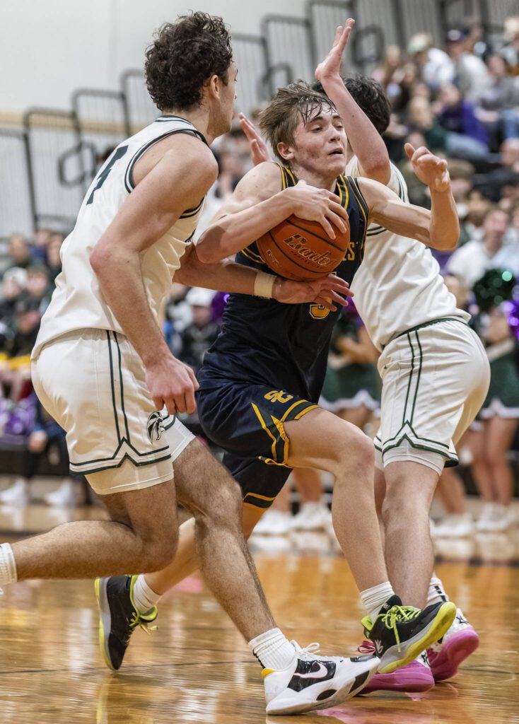 Shorecrest’s Brayden Fischer takes the ball to the hoop during the game against Edmonds-Woodway on Tuesday, Jan. 28, 2025 in Edmonds, Washington. (Olivia Vanni / The Herald)
