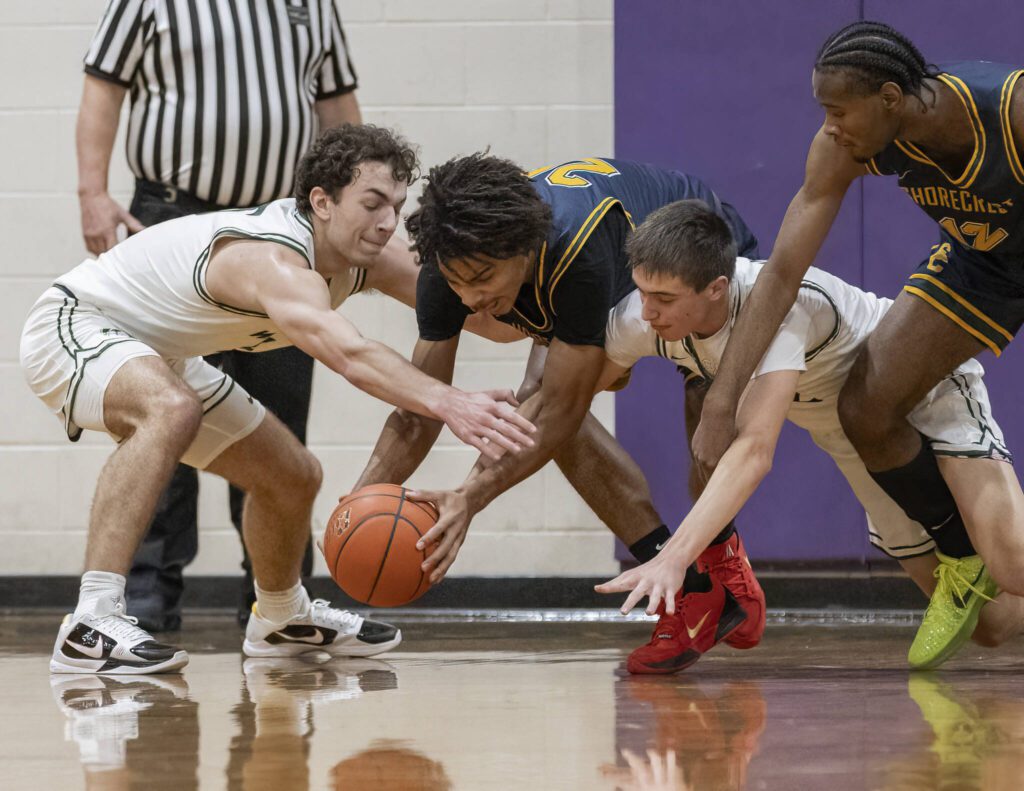 Shorecrest’s Devan Jones grabs a loose ball during the game against Edmonds-Woodway on Tuesday, Jan. 28, 2025 in Edmonds, Washington. (Olivia Vanni / The Herald)
