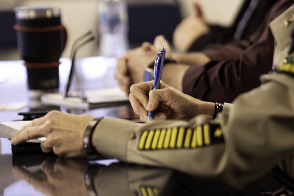 Snohomish County Sheriff Susanna Johnson takes notes during a roundtable discussion Thursday at Everett Station.
