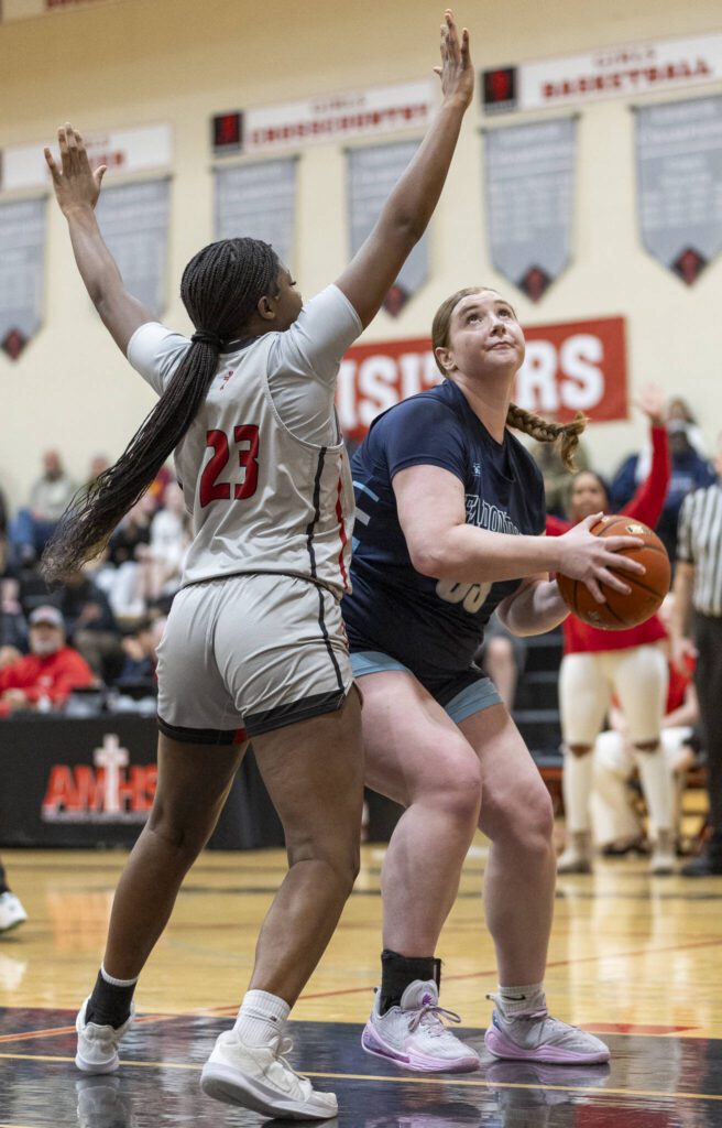 Meadowdale’s Audrey Lucas tries to make a layup while being guarded by Archbishop Murphy’s Kani Cham during the game on Thursday, Jan. 30, 2025 in Everett, Washington. (Olivia Vanni / The Herald)
