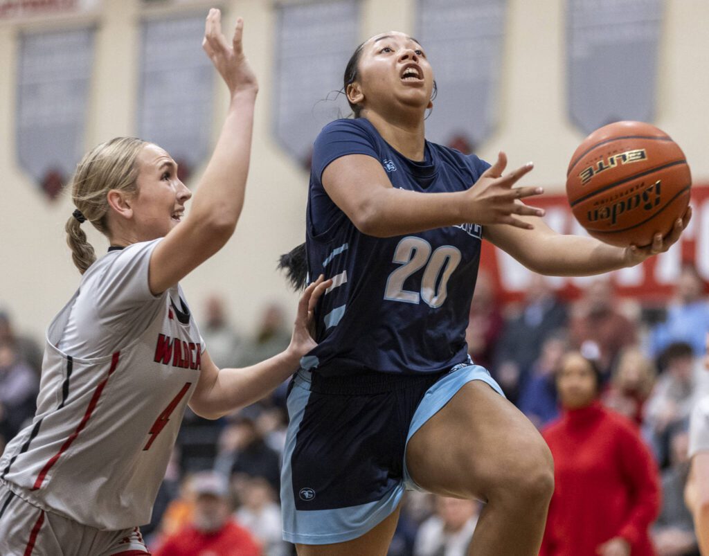 Meadowdale’s Kyairra Roussin makes a layup during the game against Archbishop Murphy on Thursday, Jan. 30, 2025 in Everett, Washington. (Olivia Vanni / The Herald)
