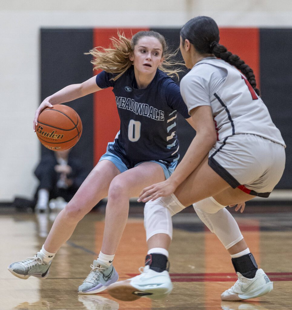 Meadowdale’s Payton Fleishman tries to maneuver around Archbishop Murphy’s Ashley Fletcher during the game on Thursday, Jan. 30, 2025 in Everett, Washington. (Olivia Vanni / The Herald)
