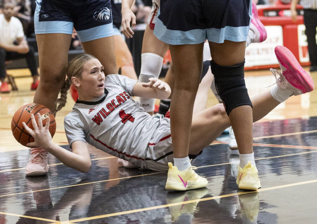 Archbishop Murphy’s Taylor Cushing is knocked to the ground during the game against Meadowdale on Thursday, Jan. 30, 2025 in Everett, Washington. (Olivia Vanni / The Herald)
