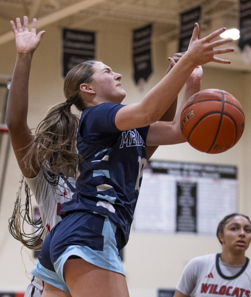 Meadowdale’s Lexi Zardis has the ball knocked out of her hand during the game against Archbishop Murphy on Thursday, Jan. 30, 2025 in Everett, Washington. (Olivia Vanni / The Herald)
