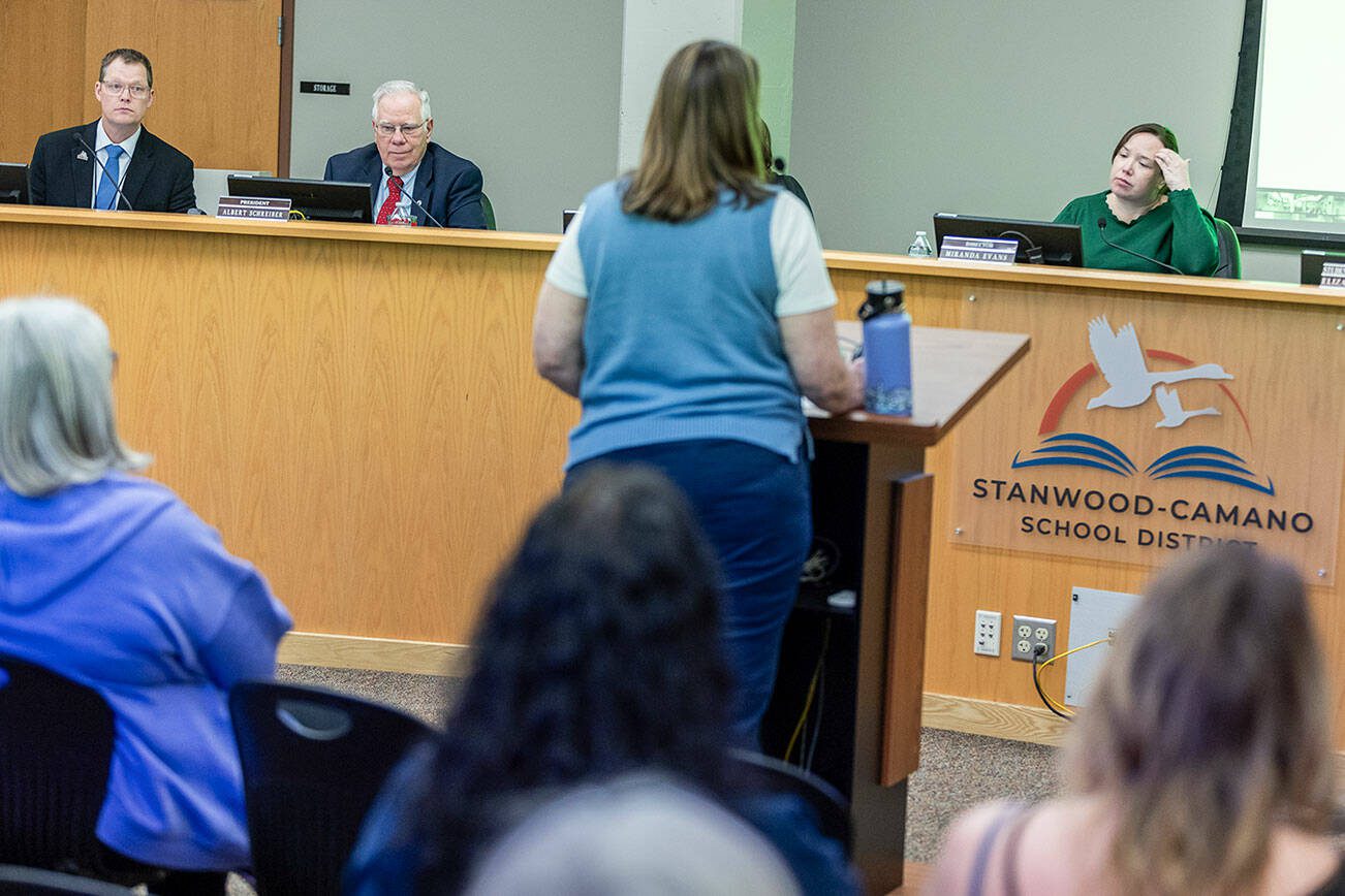 Stanwood-Camano interim superintendent Ryan Ovenell and school
Board members Al Schreiber, and Miranda Evans, left to right,  listen to a presentation during a school board meeting on Tuesday, Feb. 18, 2025 in Stanwood, Washington. (Olivia Vanni / The Herald)
