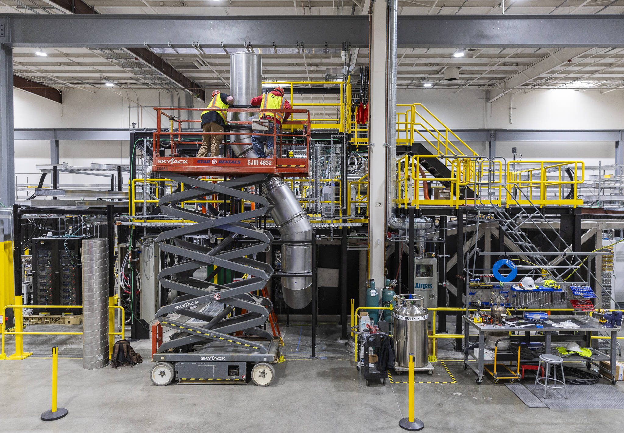 Construction contractors add exhaust pipes for Century’s liquid metal walls at Zap Energy on Monday, Feb. 3, 2025 in Everett, Washington. (Olivia Vanni / The Herald)