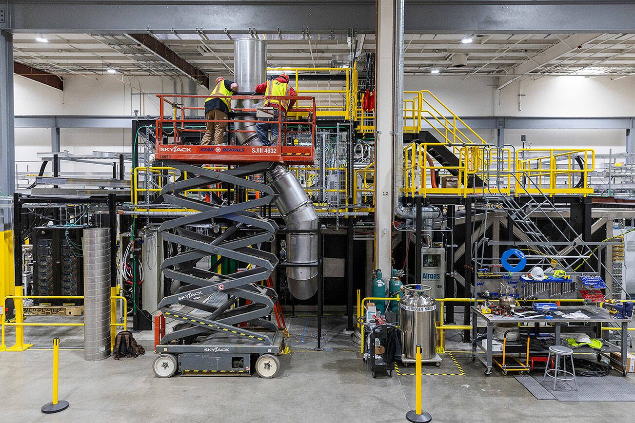 Construction contractors add exhaust pipes for Century’s liquid metal walls at Zap Energy on Monday, Feb. 3, 2025 in Everett, Washington. (Olivia Vanni / The Herald)