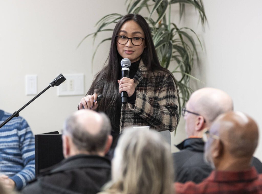 Edmonds resident Nicole Gaba makes a presentation on her research regarding how annexation into RFA will mean for the city and for individuals during an Edmonds Civic Roundtable event about the RFA annexation on Monday, Feb. 10, 2025 in Edmonds, Washington. (Olivia Vanni / The Herald)
