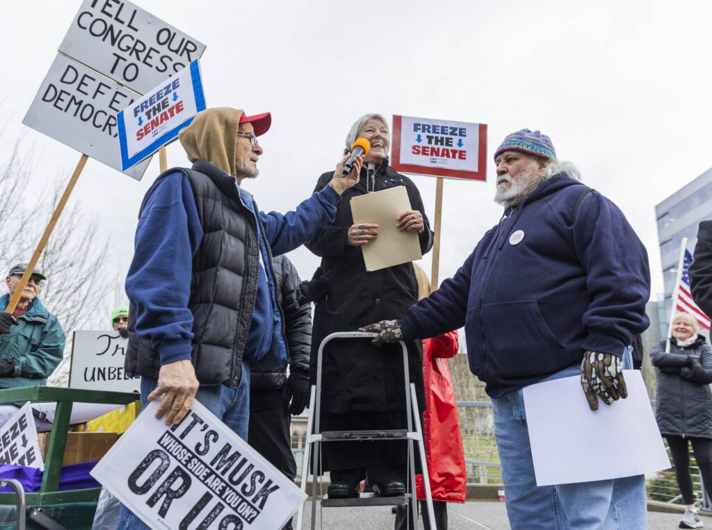 Rev. Rachel Taber-Hamilton speaks to those gathered on the Snohomish County Campus during a rally organized by Snohomish County Indivisible at the Snohomish County Campus on Wednesday, Feb. 5, 2025 in Everett, Washington. (Olivia Vanni / The Herald)
