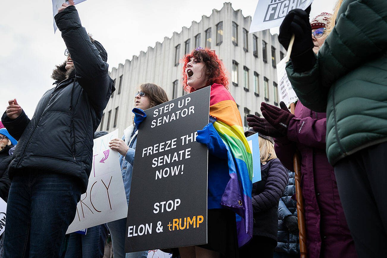 Ari Smith, 14, cheers in agreement with one of the speakers during Snohomish County Indivisible’s senator office rally at the Snohomish County Campus on Wednesday, Feb. 5, 2025 in Everett, Washington. (Olivia Vanni / The Herald)