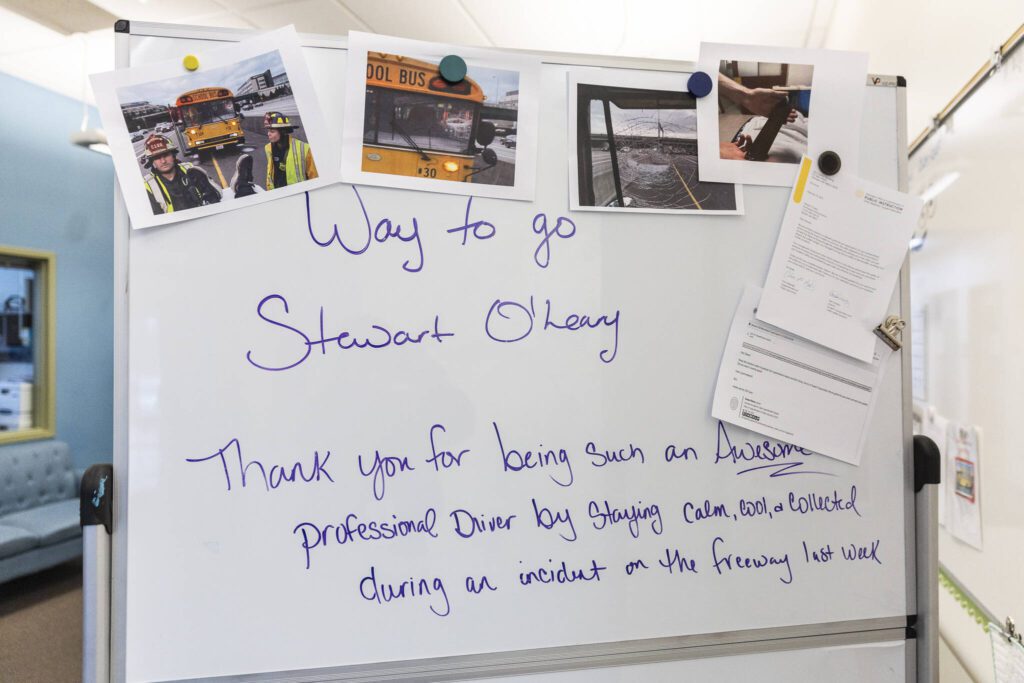 A whiteboard in the Northshore School District Transportation Center building displays photographs and well-wishes to O’Leary on Friday, Feb. 14, 2025 in Bothell, Washington. (Olivia Vanni / The Herald)
