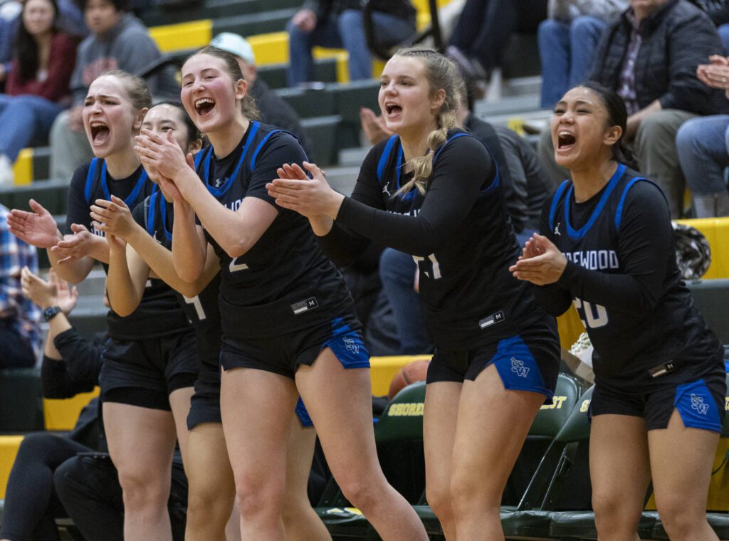 The Shorewood bench reacts to three point shot during the 3A district playoff game against Shorecrest on Friday, Feb. 14, 2025 in Shoreline, Washington. (Olivia Vanni / The Herald)
