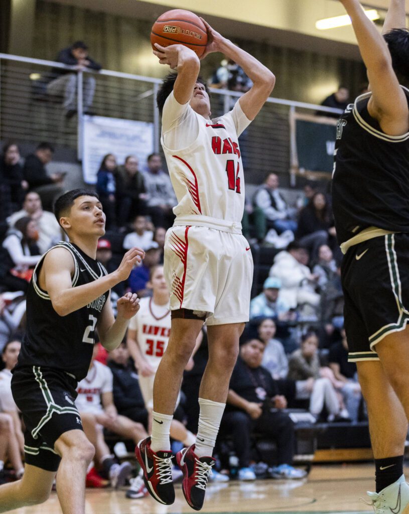 Tulalip Heritage’s James Jones makes a jump shot during the winner-to-state playoff game against Muckleshoot Tribal School on Tuesday, Feb. 18, 2025 in Marysville, Washington. (Olivia Vanni / The Herald)
