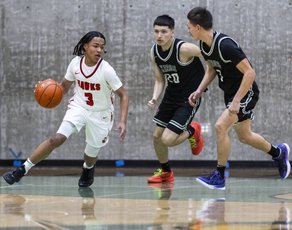 Tulalip Heritage’s JJ Gray dribbles the ball down the court during the winner-to-state playoff game against Muckleshoot Tribal School on Tuesday, Feb. 18, 2025 in Marysville, Washington. (Olivia Vanni / The Herald)
