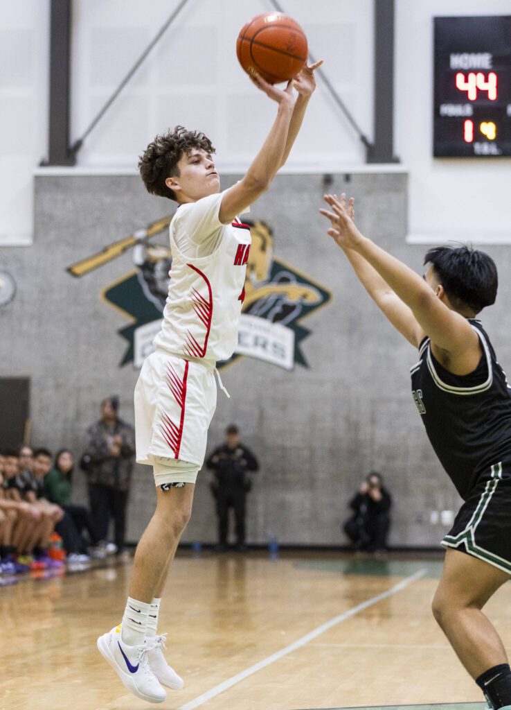 Tulalip Heritage’s Davien Parks makes a 3-point shot during the winner-to-state playoff game against Muckleshoot Tribal School on Tuesday, Feb. 18, 2025 in Marysville, Washington. (Olivia Vanni / The Herald)
