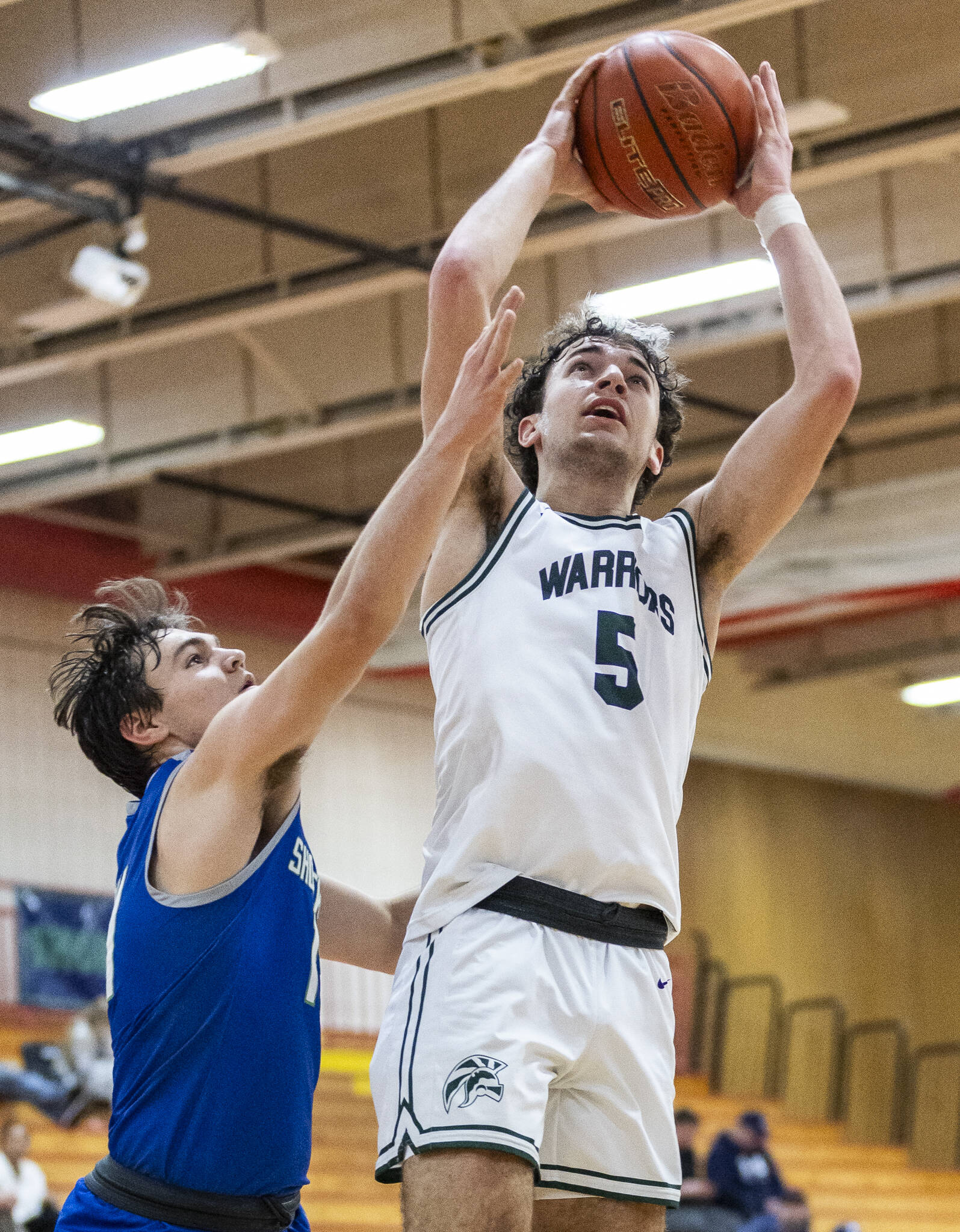 Edmonds-Woodway’s Cam Hiatt makes a layup during the 3A district semifinal game against Shorewood on Wednesday, Feb. 19, 2025 in Marysville, Washington. (Olivia Vanni / The Herald)