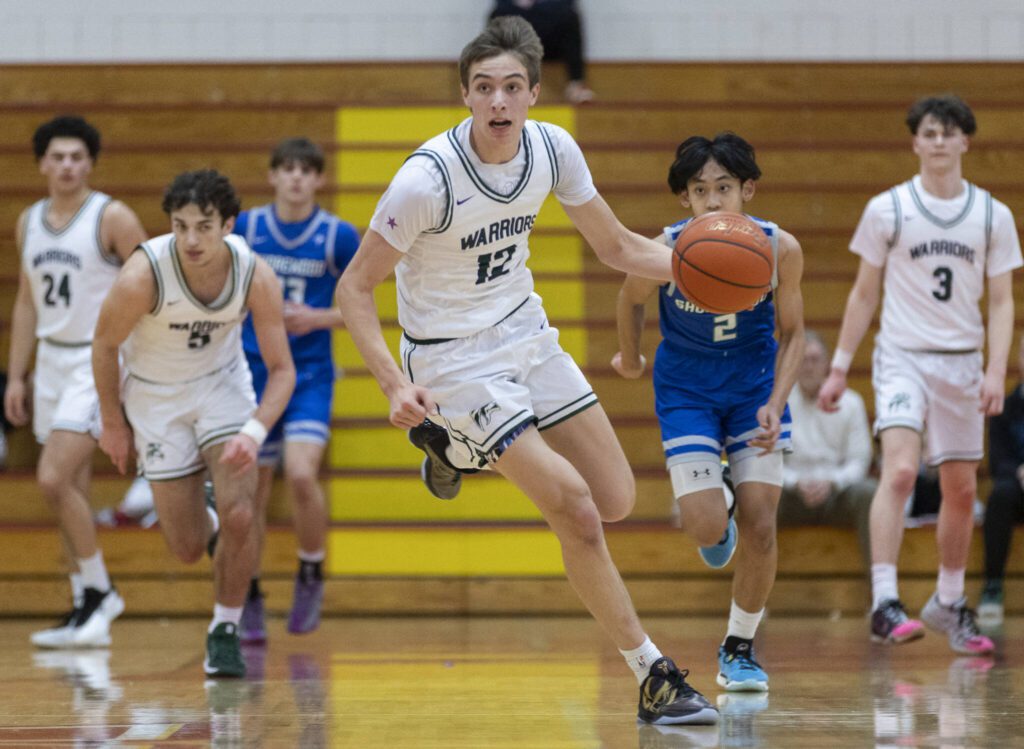 Edmonds-Woodway’s William Alseth takes the ball down the court during the 3A district semifinal game against Shorewood on Wednesday, Feb. 19, 2025 in Marysville, Washington. (Olivia Vanni / The Herald)
