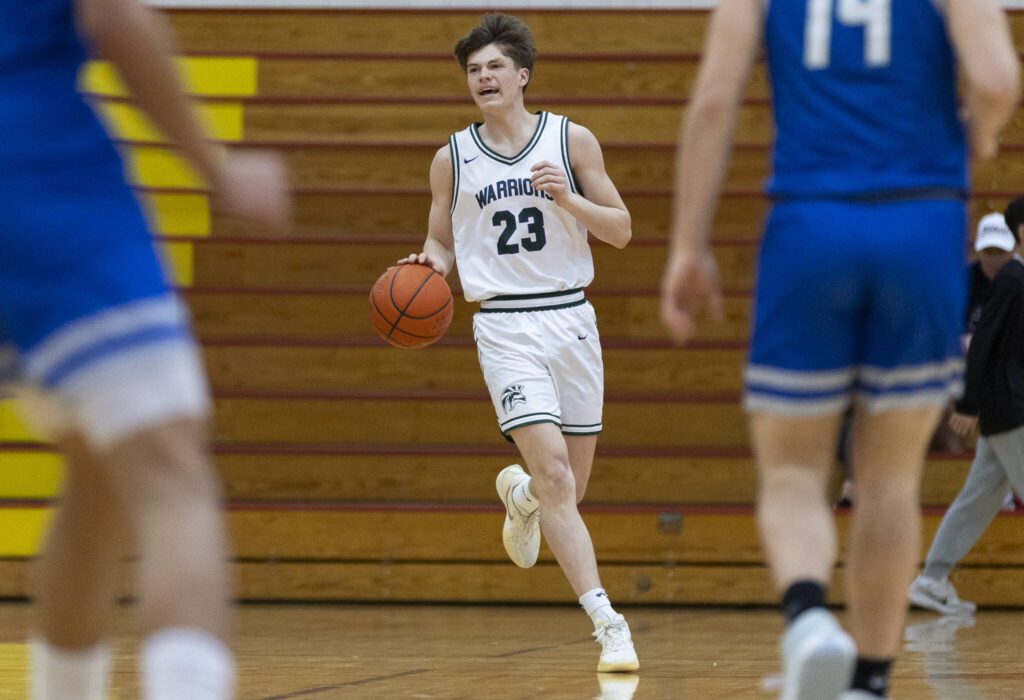 Edmonds-Woodway’s DJ Karl calls out a play as he takes the ball down the court during the 3A district semifinal game against Shorewood on Wednesday, Feb. 19, 2025 in Marysville, Washington. (Olivia Vanni / The Herald)
