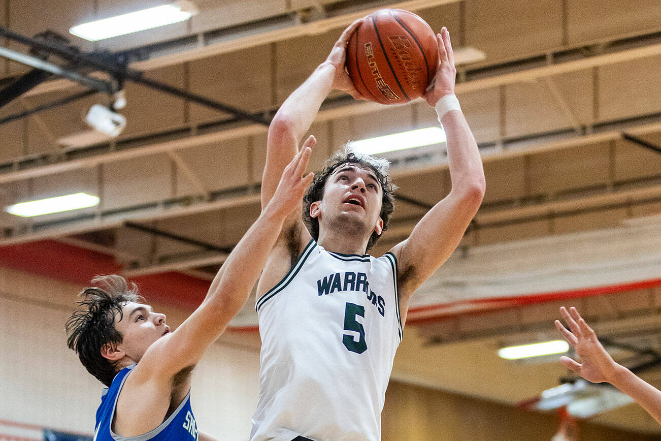 Edmonds-Woodway’s Cam Hiatt makes a layup during the 3A district semifinal game against Shorewood on Wednesday, Feb. 19, 2025 in Marysville, Washington. (Olivia Vanni / The Herald)