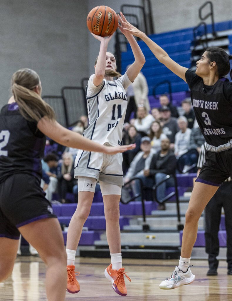Glacier Peak’s Zoey Ritter makes a 3-point shot during the 4A district loser-out playoff game against North Creek on Thursday, Feb. 20, 2025 in Kirkland, Washington. (Olivia Vanni / The Herald)

