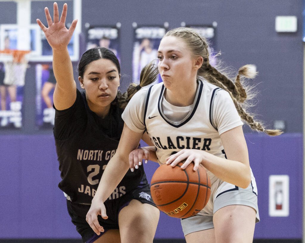 Glacier Peak’s Rikki Miller dribbles toward the basket during the 4A district loser-out playoff game against North Creek on Thursday, Feb. 20, 2025 in Kirkland, Washington. (Olivia Vanni / The Herald)
