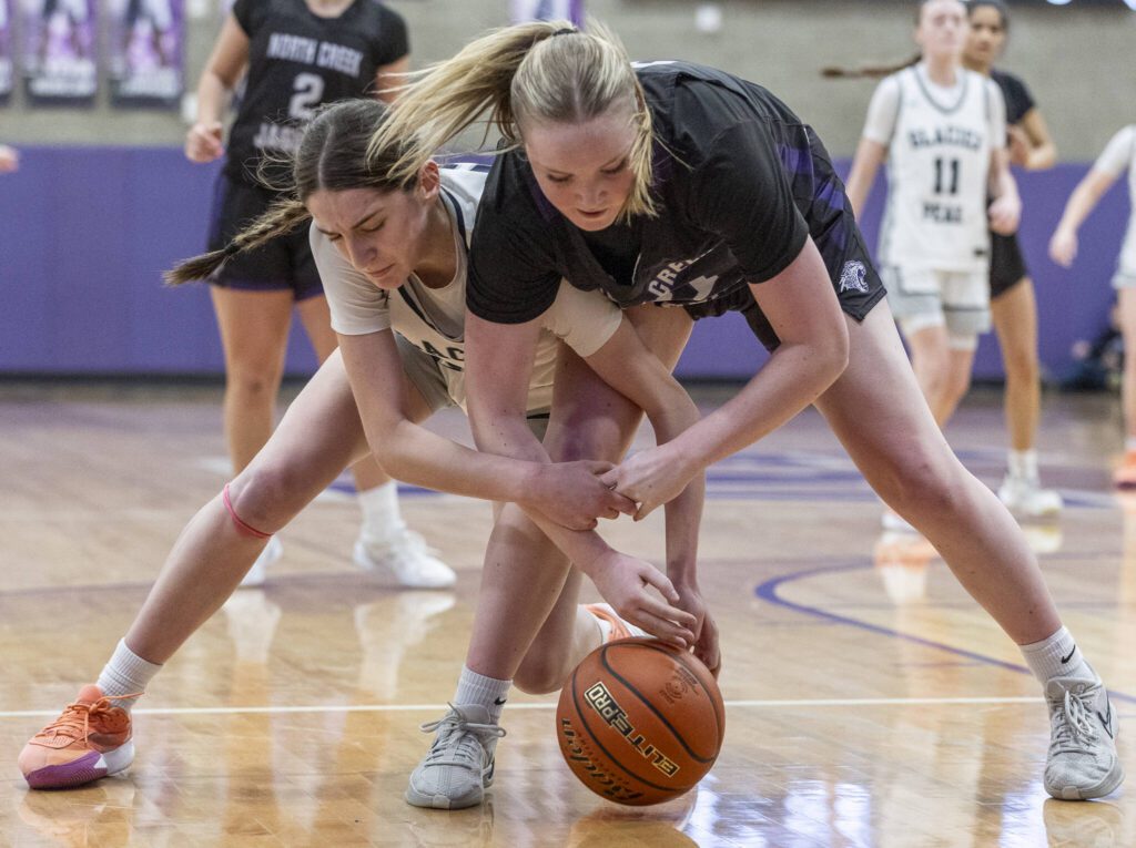 Glacier Peak’s Lillian Riechelson scrambles for a loose ball during the 4A district loser-out playoff game against North Creek on Thursday, Feb. 20, 2025 in Kirkland, Washington. (Olivia Vanni / The Herald)
