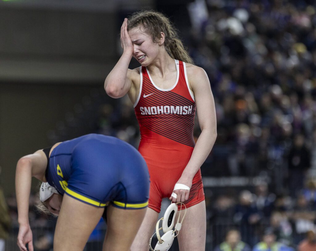 Snohomish’s Malia Ottow becomes emotional after winning the 3A girls 120-pound championship title at the Mat Classic on Friday, Feb. 21, 2025 in Tacoma, Washington. (Olivia Vanni / The Herald)

