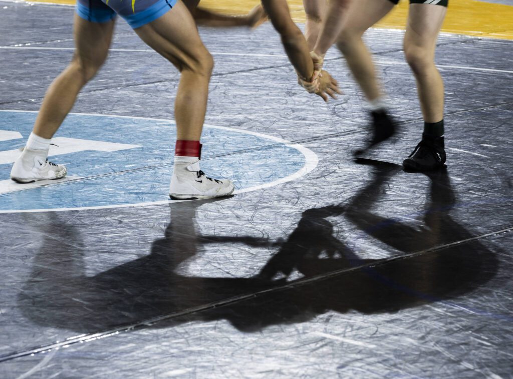 Wresters battle for hand control at the Mat Classic on Friday, Feb. 21, 2025 in Tacoma, Washington. (Olivia Vanni / The Herald)
