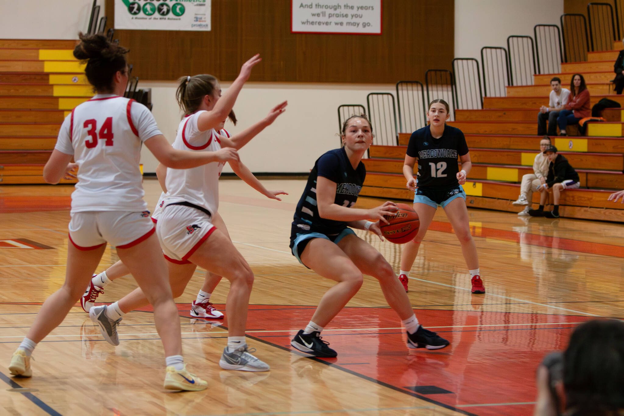 Meadowdale's Mia Brockmeyer is forced to pick up her dribble during a Feb. 22, 2025 District 1 3A playoff game against Snohomish at Marysville Pilchuck High School. (Qasim Ali / The Herald)
