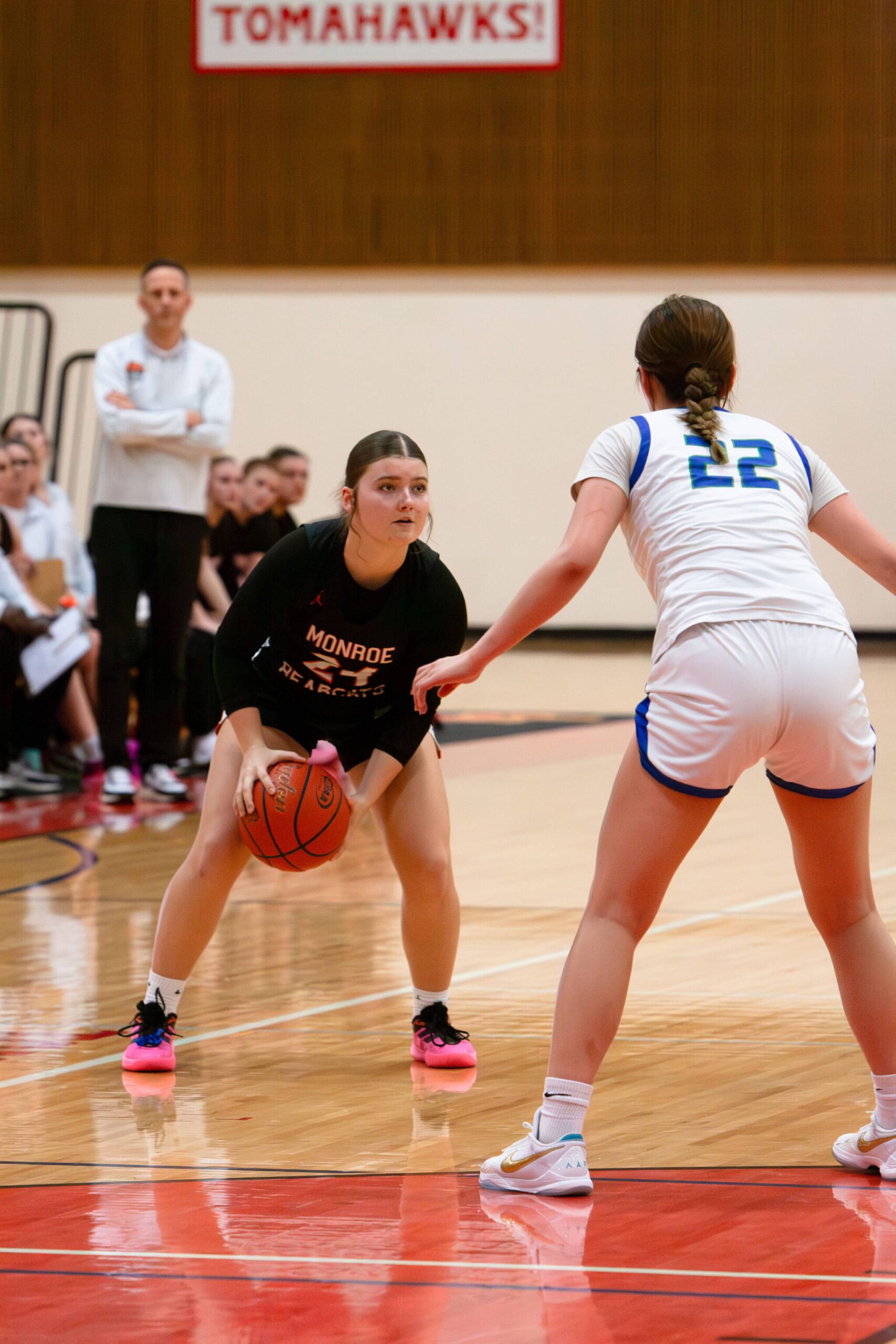 Monroe’s Brooklyn Krache surveys the floor as Shorewood’s Clara Djohan defends during a Feb. 22, 2025 District 1 3A playoff game at Marysville Pilchuck High School. (Qasim Ali / The Herald)