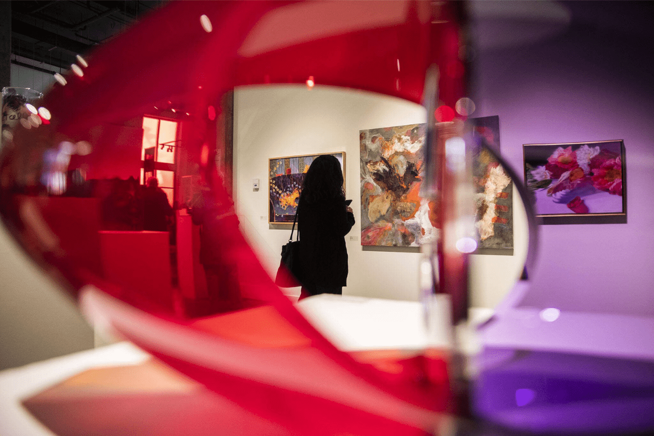 A person pauses to look at an art piece during the Schack Art Center’s 50th anniversary celebration on Thursday, Oct. 10, 2024 in Everett, Washington. (Olivia Vanni / The Herald)