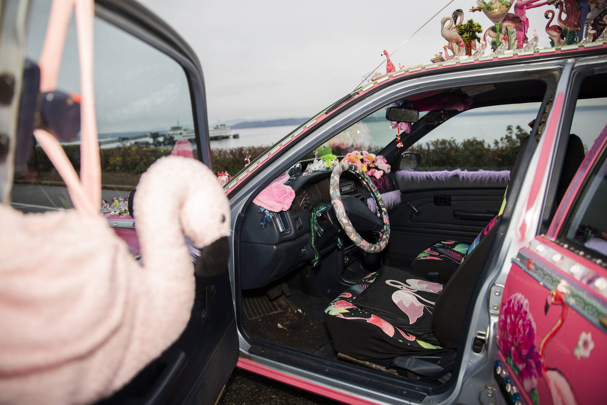 Flamingos fill the inside of Marty Vale’s art car. (Olivia Vanni / The Herald)