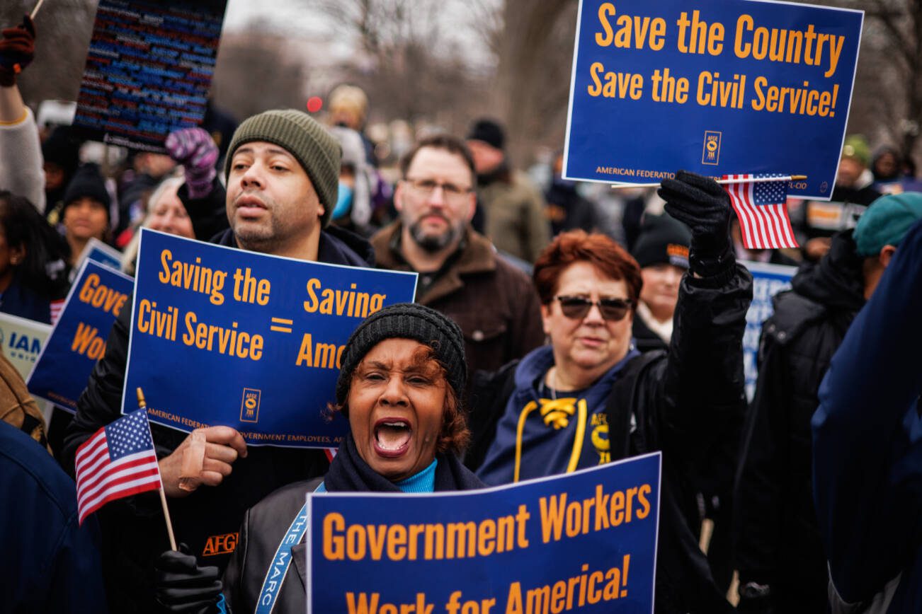 FILE  — Members of the American Federation of Government Employees rally outside the U.S. Capitol building in Washington, Feb. 11, 2025. A group of 21 civil servants with technology expertise resigned on Feb. 25 rather than help implement an array of changes to the federal government being pushed by the billionaire Elon Musk and his so-called Department of Government Efficiency. (Samuel Corum/The New York Times)