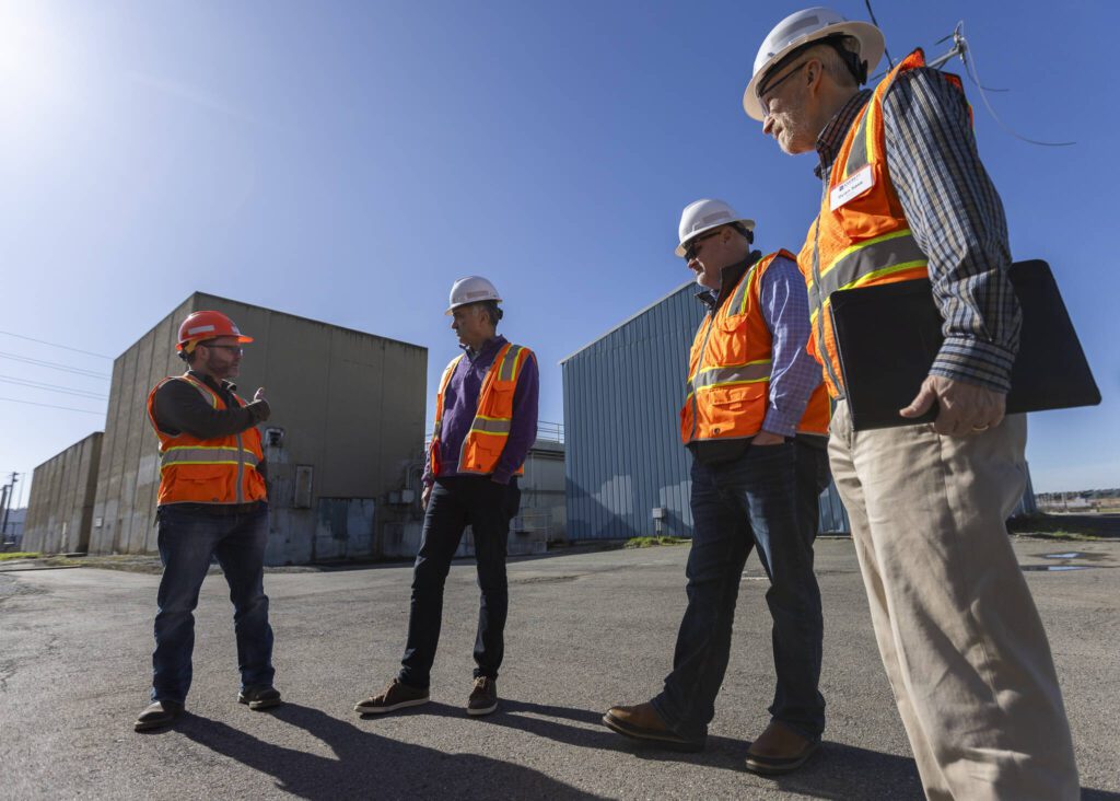 City of Everett Principal Engineer Zach Brown, Utilities Engineering Manager Souheil Nasr, Operations Superintendent Jeff Marrs and Public Work Director Ryan L. Sass outside of the Port Gardner Storage Facility on Thursday, Feb. 27, 2025 in Everett, Washington. (Olivia Vanni / The Herald)
