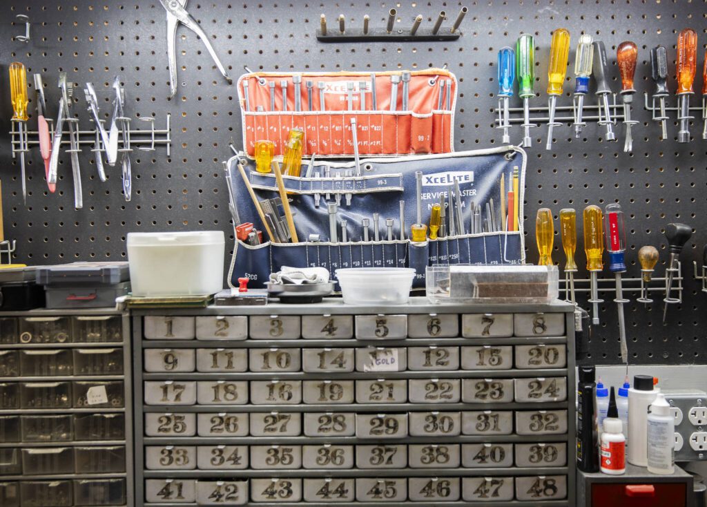 Different tools and pieces are used for accordion repairs and maintenance. (Olivia Vanni / The Herald)
