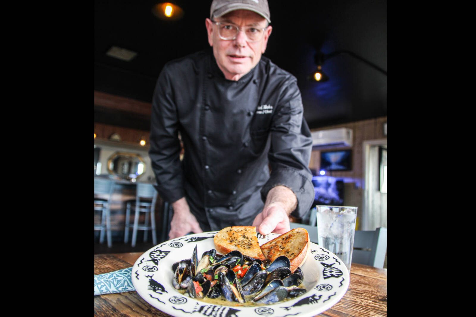 Whidbey Island chef Michael Weeks welcomes visitors to Penn Cove Musselfest, returning to Whidbey Island, Washington, March 7 to 9. Photo by Luisa Loi