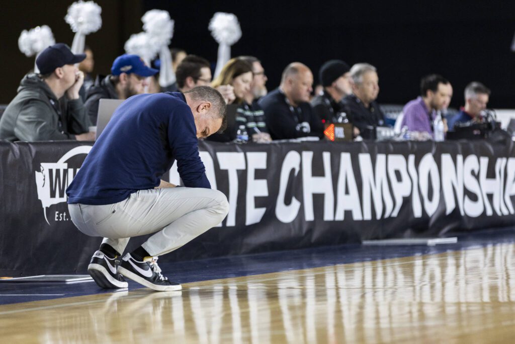 Glacier Peak head coach Brian Hunter hangs his head as Gonzaga Prep takes the lead during the 4A boys semifinal game on Friday, March 7, 2025 in Tacoma, Washington. (Olivia Vanni / The Herald)
