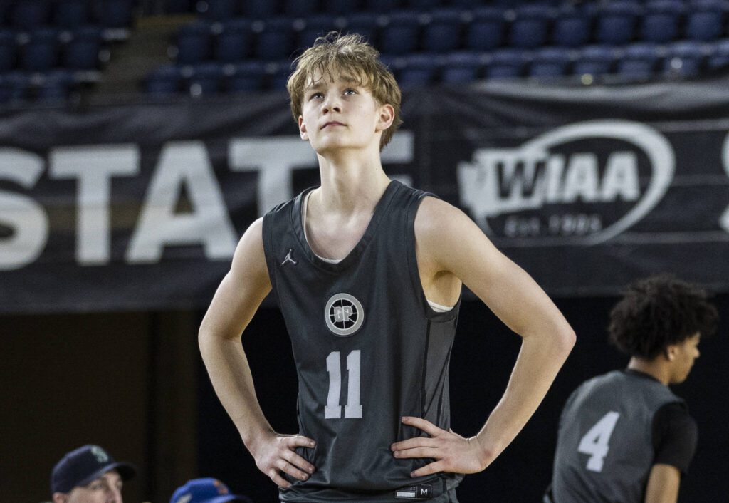 Glacier Peak’s Reed Nagel looks up at scoreboard as he walks off the court after fouling out during the 4A boys semifinal game against Gonzaga Prep on Friday, March 7, 2025 in Tacoma, Washington. (Olivia Vanni / The Herald)
