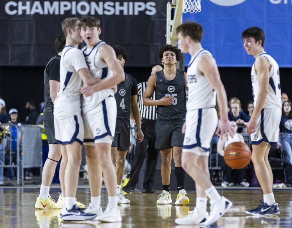 Glacier Peak players react to losing to Gonzaga Prep in the 4A boys semifinal game on Friday, March 7, 2025 in Tacoma, Washington. (Olivia Vanni / The Herald)

