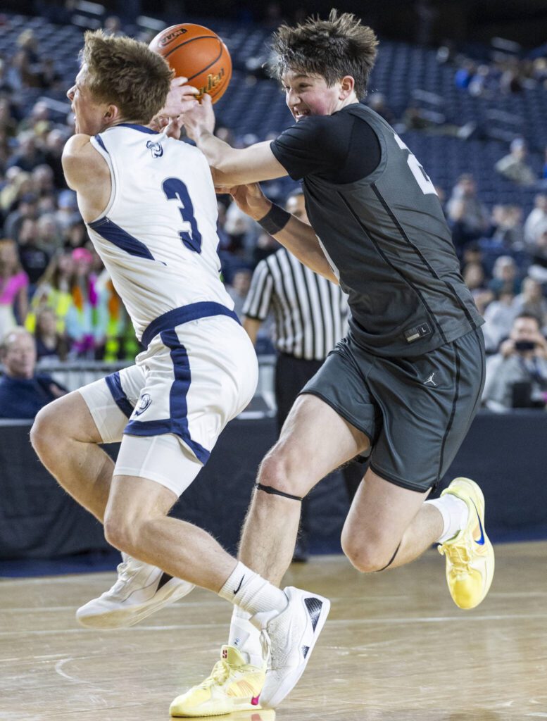 Glacier Peak’s Zachary Albright has the ball knocked away by Gonzaga Prep’s Hudson Floyd during the 4A boys semifinal game on Friday, March 7, 2025 in Tacoma, Washington. (Olivia Vanni / The Herald)
