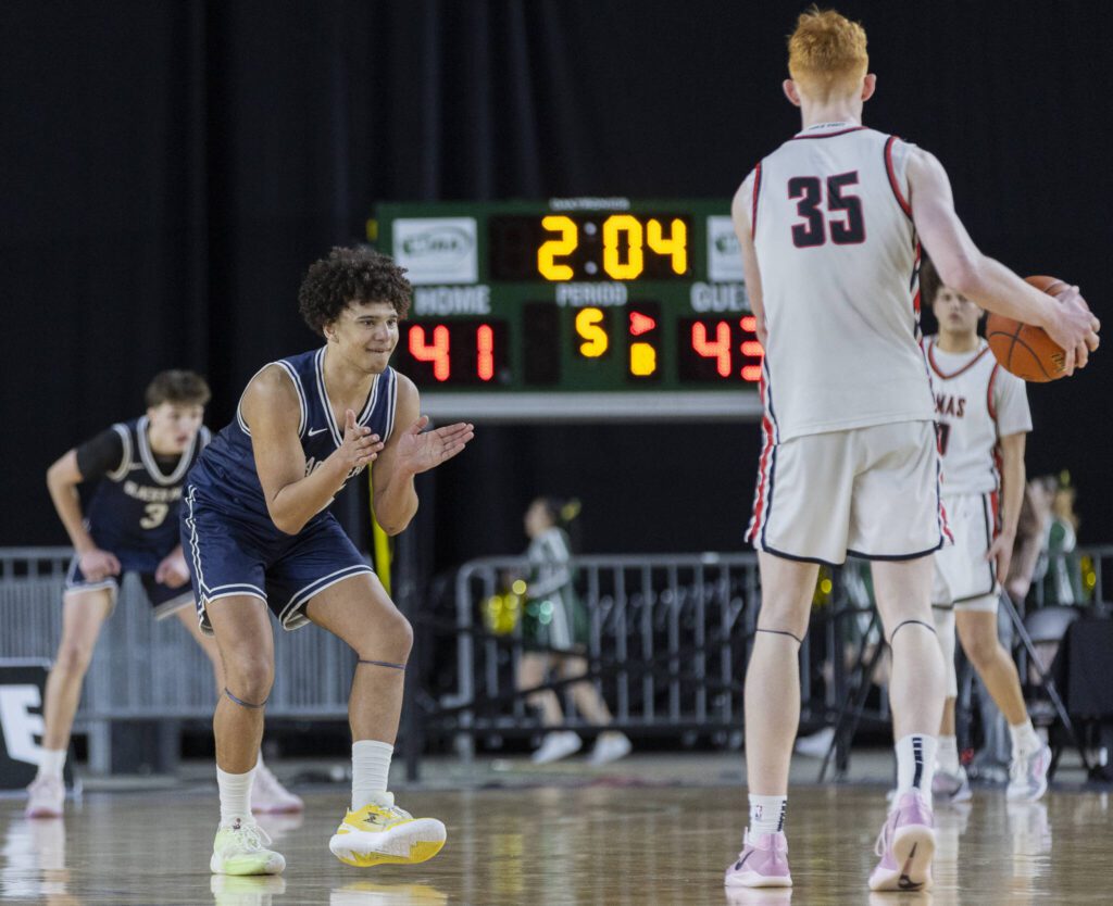 Glacier Peak’s Jayce Nelson claps as Camas’ Ethan Harris brings the ball down the court during the 4A boys quarterfinal game against Camas on Thursday, March 6, 2025 in Tacoma, Washington. (Olivia Vanni / The Herald)
